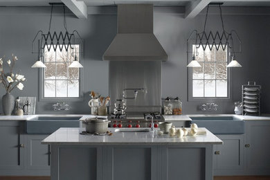 Example of a large cottage u-shaped medium tone wood floor eat-in kitchen design in Philadelphia with a farmhouse sink, shaker cabinets, gray cabinets, granite countertops, an island, gray backsplash, stone slab backsplash and stainless steel appliances