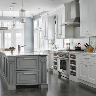 Transitional eat-in kitchen photos - Eat-in kitchen - transitional galley eat-in kitchen idea in New York with beaded inset cabinets, white cabinets, stainless steel appliances, an island, gray backsplash and white countertops