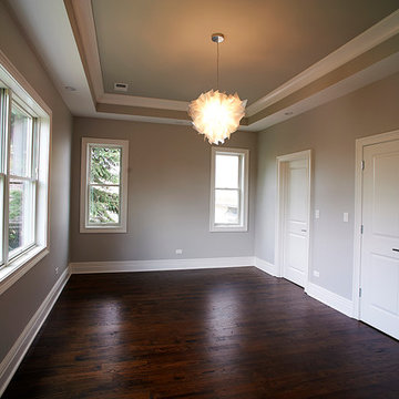 Modern Living Room with Hardwood Floors, Tray Ceiling, and Large Windows