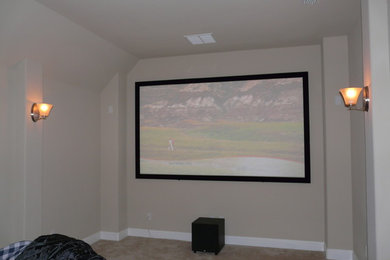Inspiration for a transitional enclosed home theatre in Dallas with beige walls, carpet, a projector screen and beige floor.