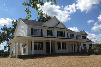 Inspiration for a large white two-story vinyl exterior home remodel in Baltimore