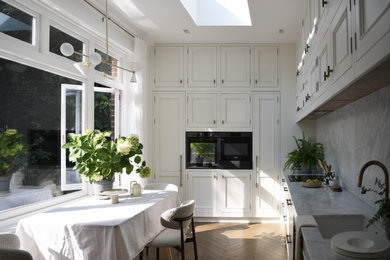 Mid-sized elegant kitchen photo in London