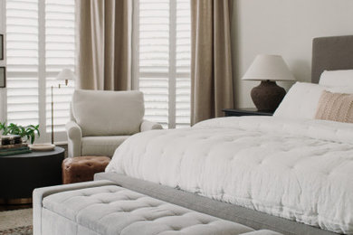 Inspiration for a transitional master bedroom remodel in Dallas with white walls