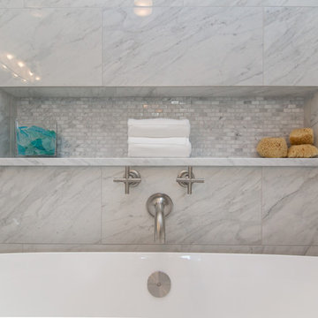Bathroom | Elegant Custom Cabinets | Marble Tile & Freestanding Tub