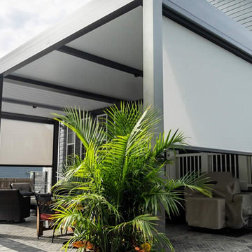 Azenco Motorized Privacy & Weather Screens: Versatility Meets Protection