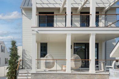 Example of a beach style home design design in Philadelphia