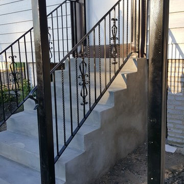 AFTER PHOTO Front Porch wood to concrete with wrought iron hand rails