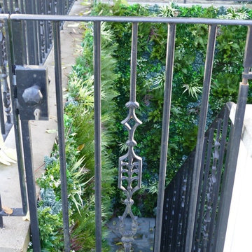 Unsightly Staircase gets Upgraded with Fake Green Walls