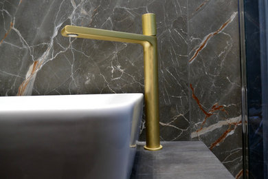 Modern wet room bathroom in Other with a wall mounted toilet, porcelain tiles, porcelain flooring and a single sink.