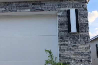 Mid-sized trendy two-car garage photo in Miami