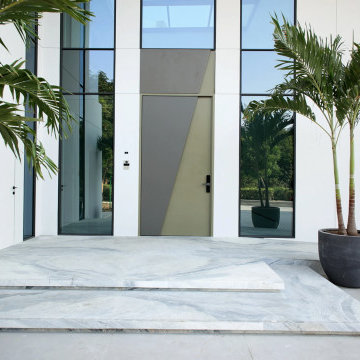 Double-Height Main Entrance with Full-Height Glazing