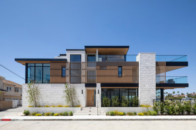 Inspiration for a coastal exterior home remodel in Orange County