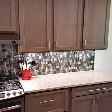 Warm, Grey Stained Oak Kitchen with Modern Accents