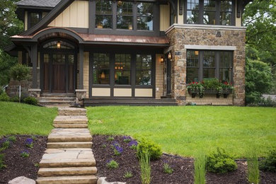 Mid-sized brown three-story gable roof photo in Minneapolis