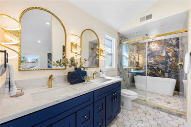 Example of a large minimalist master blue tile and porcelain tile porcelain tile, white floor, double-sink, tray ceiling and wall paneling bathroom design in Orange County with shaker cabinets, blue cabinets, a bidet, blue walls, an undermount sink, quartz countertops, white countertops and a built-in vanity
