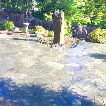 Chocolate Charcoal Quartzite Flagstone Patio with Basalt Column Fountain