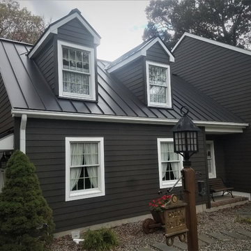 Rich Espresso Cedarmill Hardie Planks and Dark Bronze Standing Seam Metal Roof