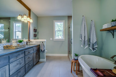 Inspiration for a master beige floor bathroom remodel in Portland with medium tone wood cabinets, green walls, an undermount sink, a hinged shower door, gray countertops and shaker cabinets
