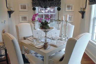 Inspiration for a mid-sized modern medium tone wood floor and multicolored floor kitchen/dining room combo remodel in Indianapolis with white walls and no fireplace