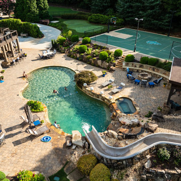 Luxury Resort-Style Backyard with Pool, Slide & Sports Courts