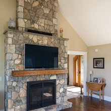 stone mantle wall with tv