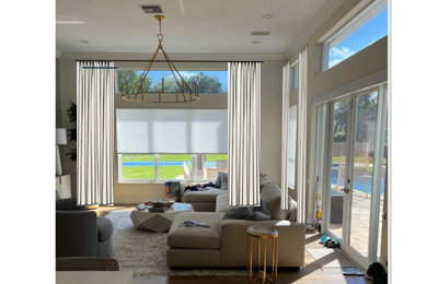Medium sized mediterranean formal living room in Orange County with beige walls, travertine flooring, no fireplace and brown floors.