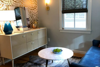 Example of a small minimalist open concept light wood floor and brown floor living room design in Los Angeles with gray walls