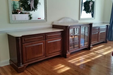 Example of a large classic open concept medium tone wood floor and brown floor living room design in Richmond with beige walls