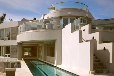 Inspiration for a large contemporary beige three-story stucco exterior home remodel in San Francisco