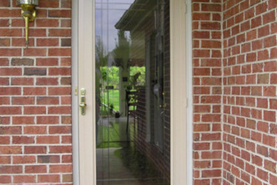 Inspiration for a small front door in Philadelphia with a single front door and a glass front door.