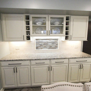 Beige Kitchen with Extra Large Island, Tile Backsplash and Granite Countertops