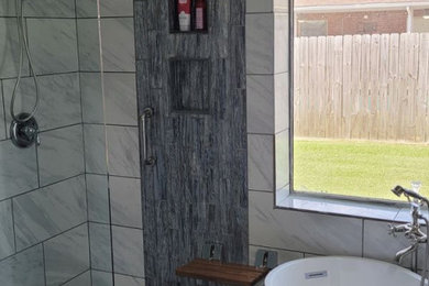 Inspiration for a mid-sized transitional gray tile bathroom remodel in Houston