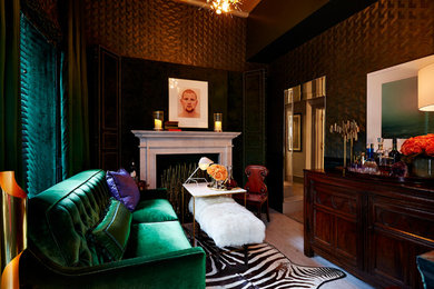 This is an example of a small traditional enclosed living room in New York with green walls, painted wood floors, a standard fireplace and a stone fireplace surround.