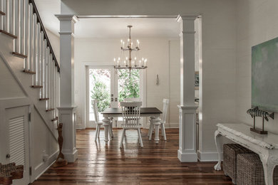 Transitional medium tone wood floor foyer photo in Miami with white walls