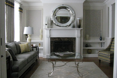 Inspiration for a mid-sized timeless formal and enclosed dark wood floor and brown floor living room remodel in New York with multicolored walls, a standard fireplace, a plaster fireplace and no tv