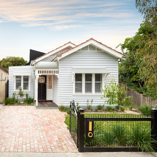 Traditional one-storey white house exterior in Melbourne with a gable roof.