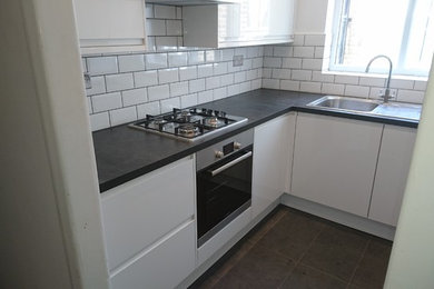 This is an example of a mid-sized kitchen in London.