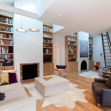 Fireplace integrated into bookshelves