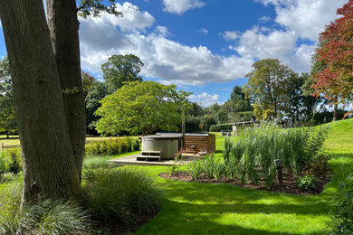 Photo of a large farmhouse back swimming pool in Hampshire.