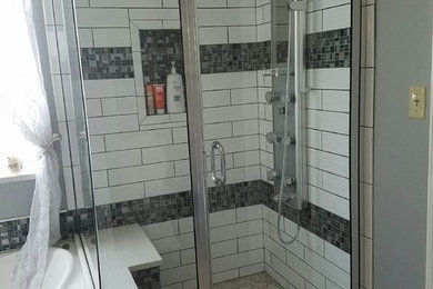 Inspiration for a mid-sized master white tile and subway tile ceramic tile and gray floor bathroom remodel in St Louis with raised-panel cabinets, white cabinets, a two-piece toilet, gray walls, an undermount sink, quartz countertops, a hinged shower door and beige countertops