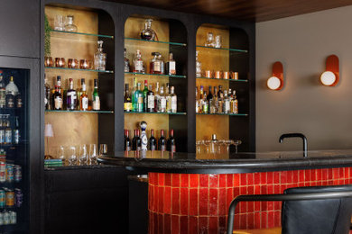 Seated home bar - large 1950s u-shaped ceramic tile and beige floor seated home bar idea in Vancouver with open cabinets, black cabinets, marble countertops, multicolored backsplash and black countertops