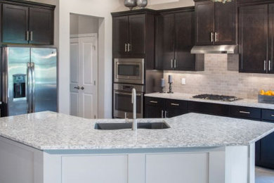 Gray & White cabinets with batwing island