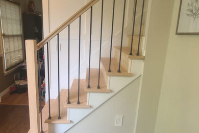 Mid-sized trendy wooden straight mixed material railing staircase photo in New York with wooden risers