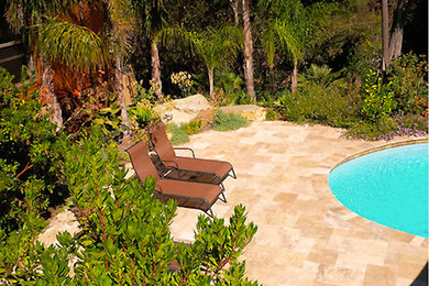 This is an example of a mid-sized beach style backyard round lap pool in San Francisco with tile and with a pool.