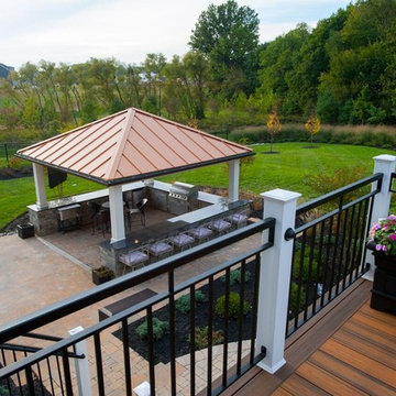 Design Builders Trex deck and outdoor kitchen with copper roof pavilion in Fulto