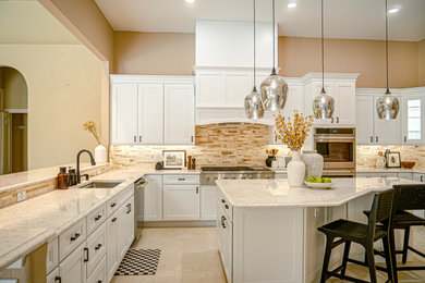 Example of a large transitional u-shaped ceramic tile and beige floor eat-in kitchen design in Tampa with a drop-in sink, shaker cabinets, yellow cabinets, quartz countertops, beige backsplash, ceramic backsplash, stainless steel appliances, an island and white countertops