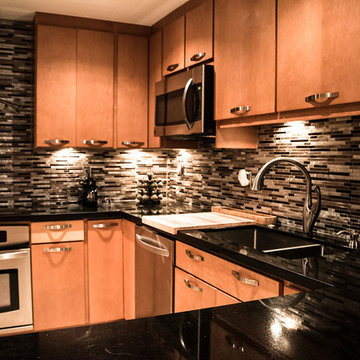 Maple kitchen cabinets with black absolute granite countertops