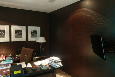 Photo of a contemporary home office in London with wallpapered walls.