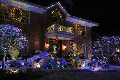 Example of a mid-sized classic brick house exterior design in Chicago