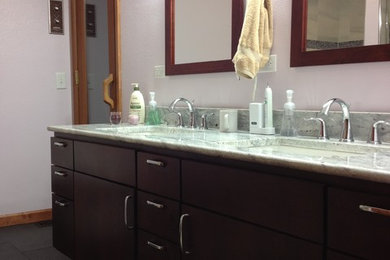 Bathroom - mid-sized traditional master bathroom idea in Other with flat-panel cabinets, dark wood cabinets, a one-piece toilet, purple walls and an undermount sink